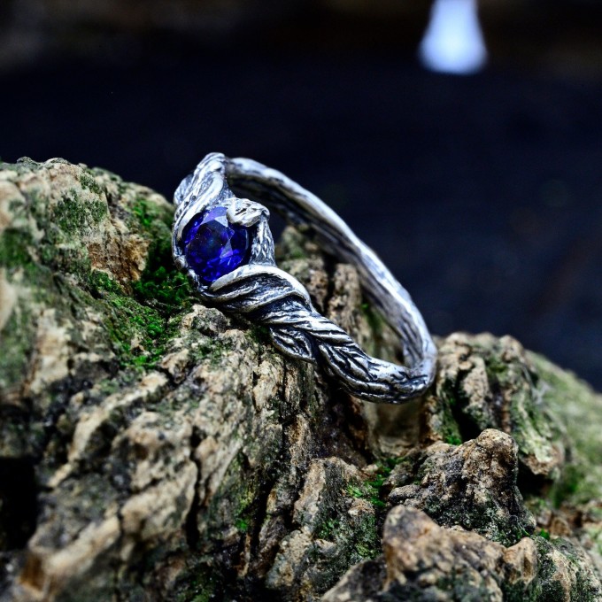 Delicate Silver Band Featuring a Blue Sapphire Gemstone