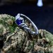 Delicate Silver Band Featuring a Blue Sapphire Gemstone