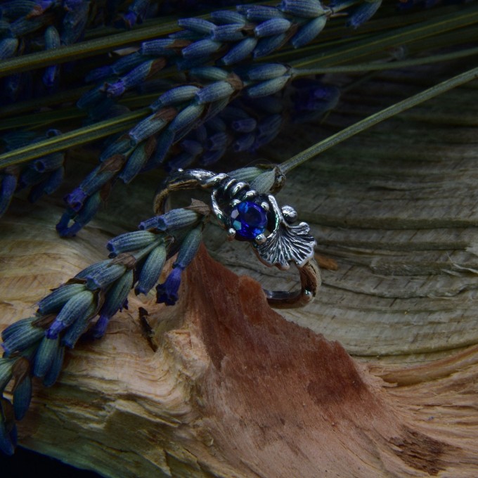 Silver Ring with Sapphire and Intricate Floral Design