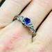 Delicate Silver Band Featuring a Blue Sapphire Gemstone