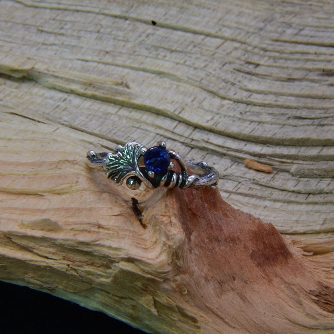 Silver Ring with Sapphire and Intricate Floral Design