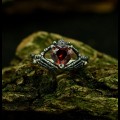 Crimson Guardian: Gothic Sterling Silver Ring with a Garnet Gemstone