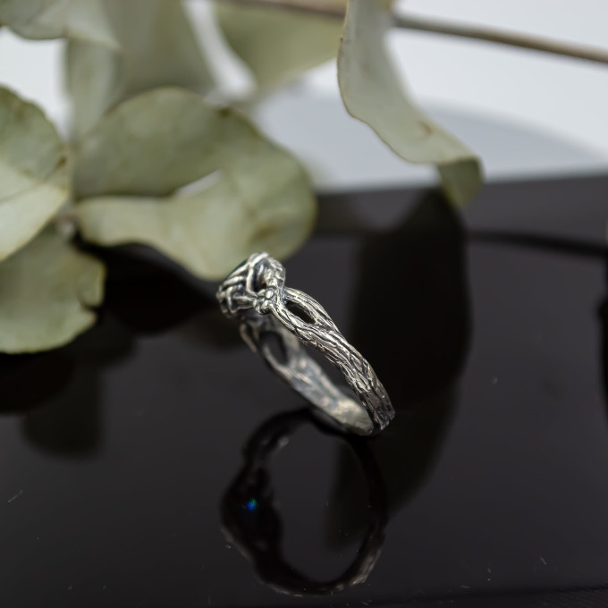 Wings of Serenity: Gothic Sterling Silver Ring with Blue Topaz