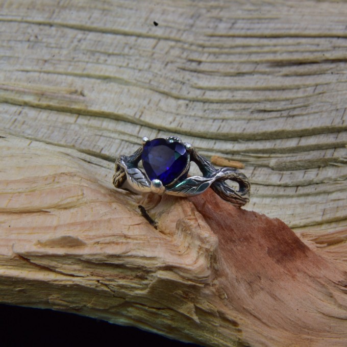 Elegant Gothic Ring with Sapphire and Intricate Design