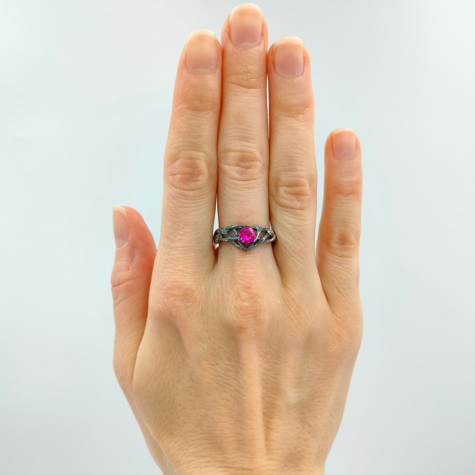 Intricate Silver Ring with Vibrant Ruby Gemstone