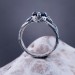 Intricate Silver Ring with Sapphire and Nature Motif