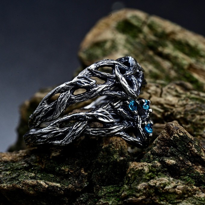 Intricate Gothic Ring with Blue Topaz Accents