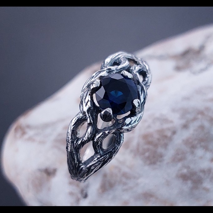 Intricate Silver Ring with Sapphire and Nature Motif