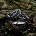 Intricate Gothic Ring with Blue Topaz Accents