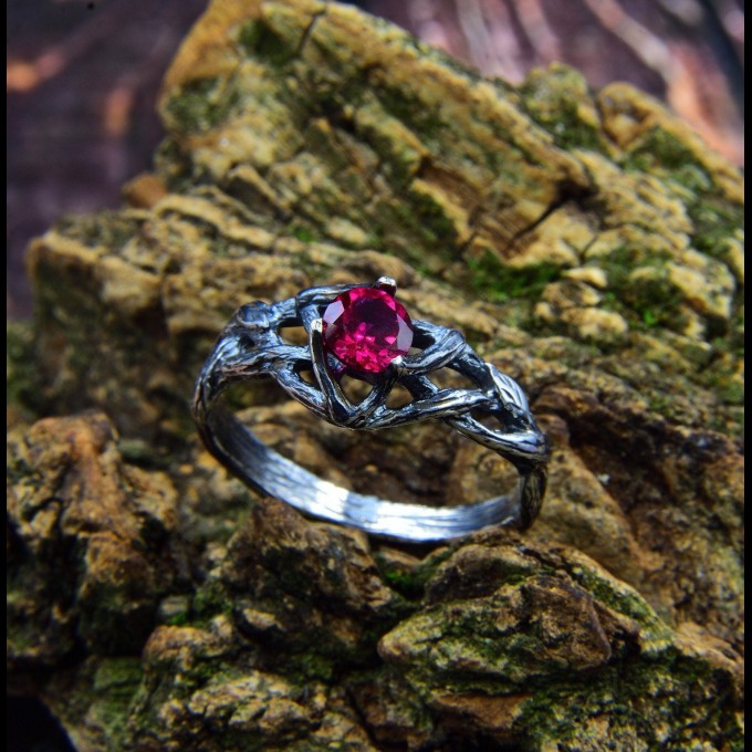Intricate Silver Ring with Vibrant Ruby Gemstone