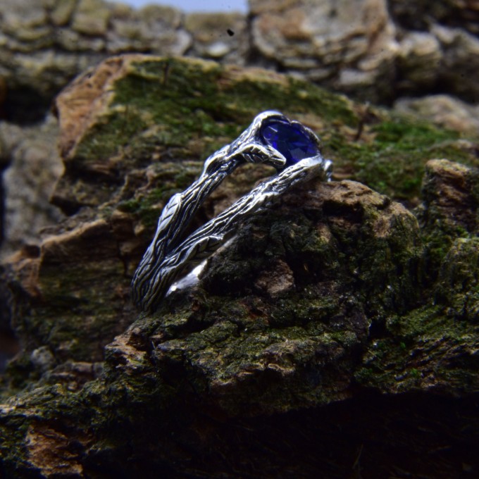 Delicate Silver Band Featuring a Blue Sapphire Gemstone