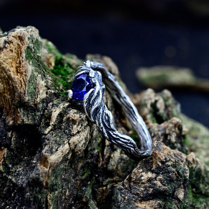 Delicate Silver Band Featuring a Blue Sapphire Gemstone
