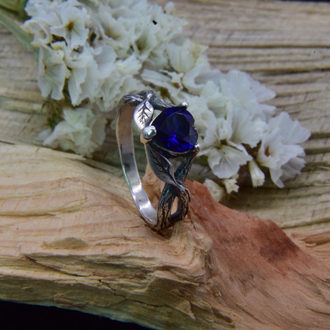 Elegant Gothic Ring with Sapphire and Intricate Design