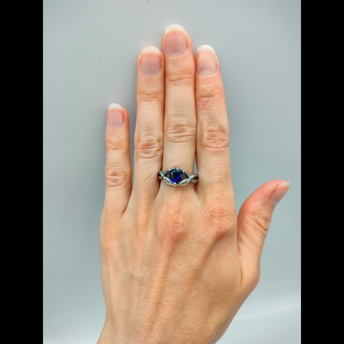 Elegant Gothic Ring with Sapphire and Intricate Design
