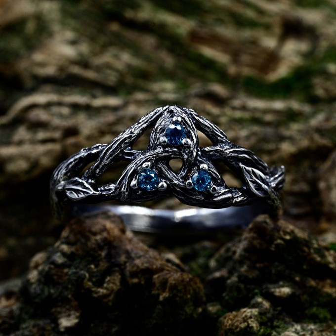 Intricate Gothic Ring with Blue Topaz Accents