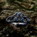 Intricate Gothic Ring with Blue Topaz Accents