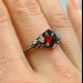 Gothic Garnet Ring with Bold Claw Design