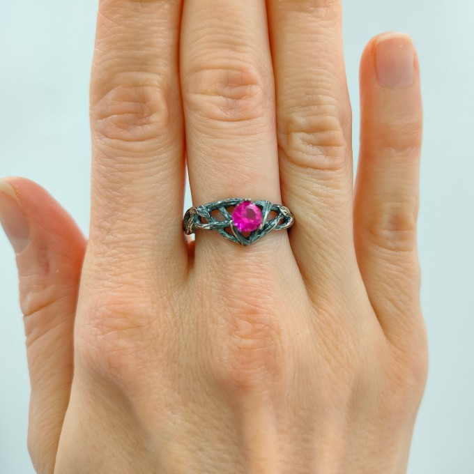 Intricate Silver Ring with Vibrant Ruby Gemstone