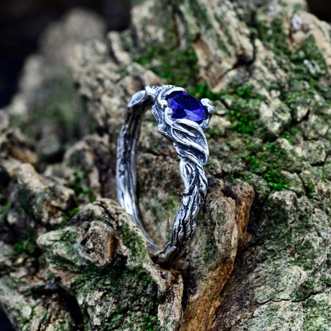 Delicate Silver Band Featuring a Blue Sapphire Gemstone