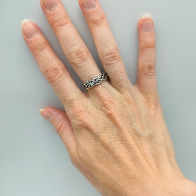 Delicate Silver Band with Intricate Weaving Design