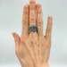 Intricate Gothic Ring with Blue Topaz Accents