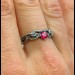 Scarlet Enchantment: Gothic Ruby Ring with Twisted Band