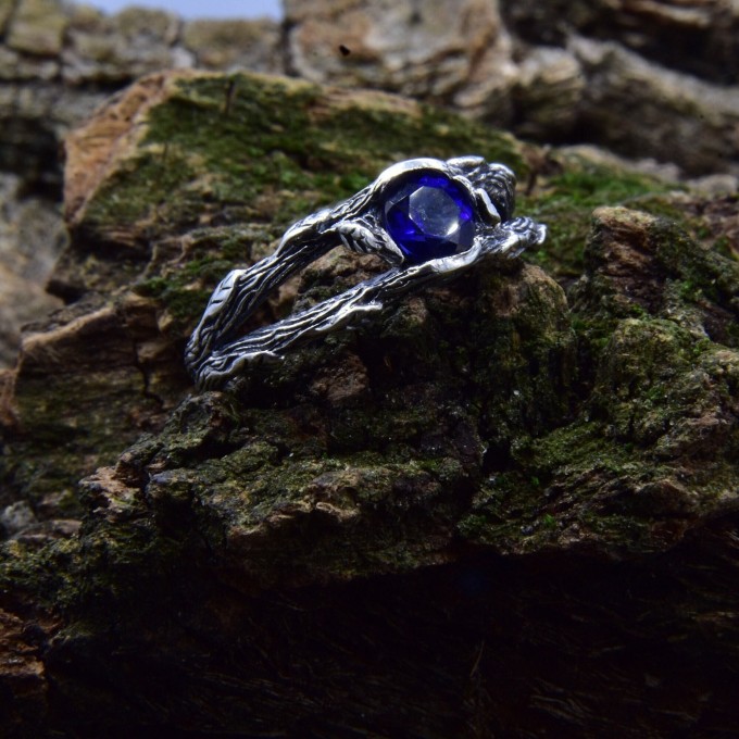 Delicate Silver Band Featuring a Blue Sapphire Gemstone