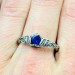 Delicate Silver Band Featuring a Blue Sapphire Gemstone