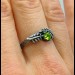Guardian's Vine: Gothic Sterling Silver Ring with Olivine Gemstone