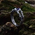 Delicate Silver Band Featuring a Blue Sapphire Gemstone