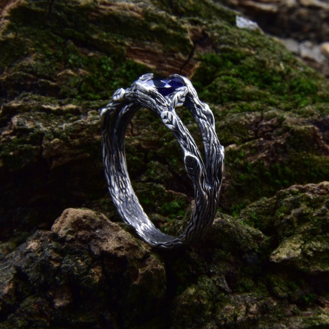 Delicate Silver Band Featuring a Blue Sapphire Gemstone