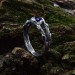 Delicate Silver Band Featuring a Blue Sapphire Gemstone
