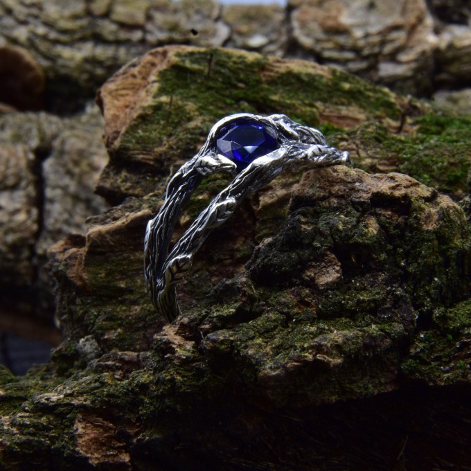 Delicate Silver Band Featuring a Blue Sapphire Gemstone