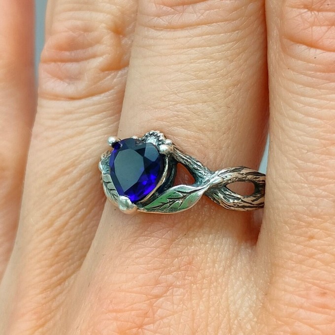 Elegant Gothic Ring with Sapphire and Intricate Design