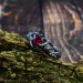 Intricate Silver Ring with Vibrant Ruby Gemstone