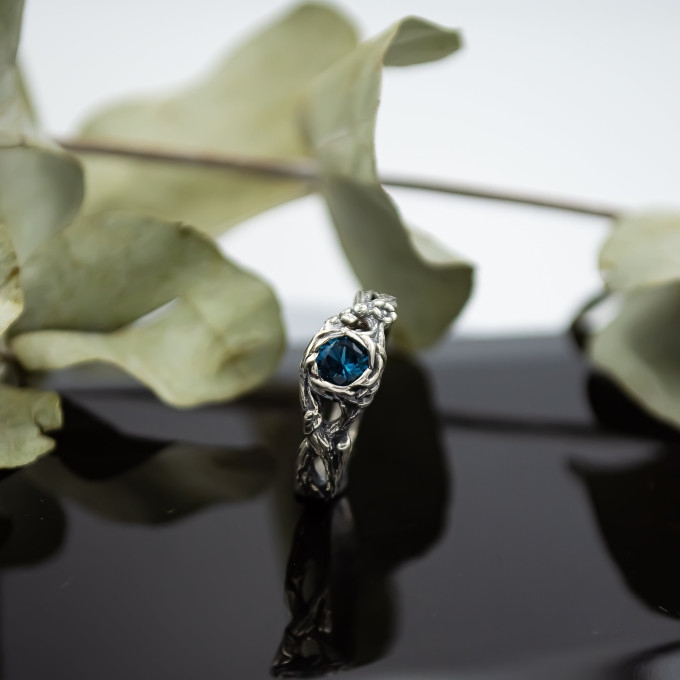 Wings of Serenity: Gothic Sterling Silver Ring with Blue Topaz
