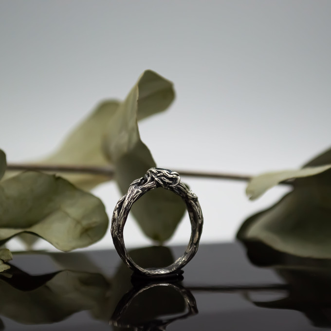 Wings of Serenity: Gothic Sterling Silver Ring with Blue Topaz