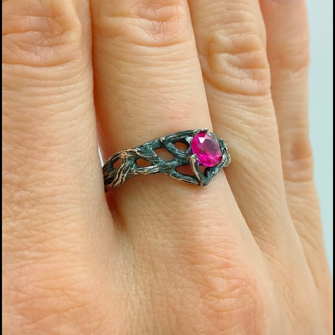 Intricate Silver Ring with Vibrant Ruby Gemstone