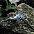 Gothic Silver Ring with a Radiant Blue Topaz