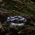 Elegant Braided Silver Ring with Celtic-Inspired Motif