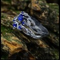 Sapphire Majesty: Sterling Silver Ring with an Enchanting Twist