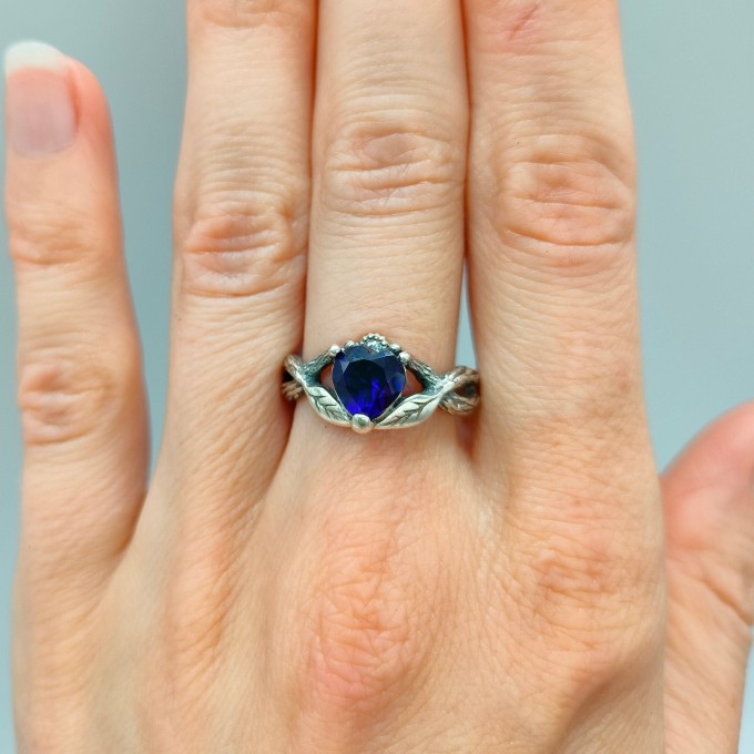Elegant Gothic Ring with Sapphire and Intricate Design