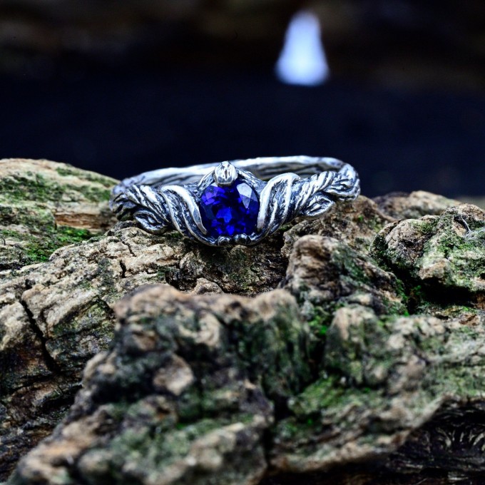 Delicate Silver Band Featuring a Blue Sapphire Gemstone