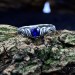 Delicate Silver Band Featuring a Blue Sapphire Gemstone