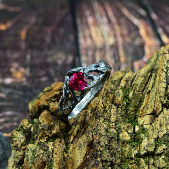 Intricate Silver Ring with Vibrant Ruby Gemstone