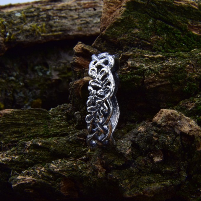 Delicate Silver Band with Intricate Weaving Design