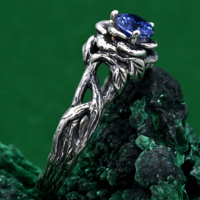 Enchanting Floral Sterling Silver Ring with Blue Sapphire Glow