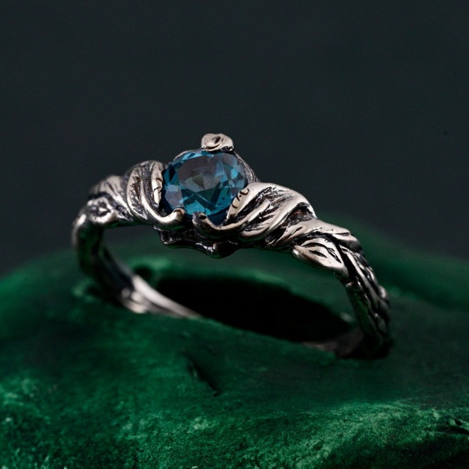 Gothic Silver Ring with Sapphire and Flowing Design