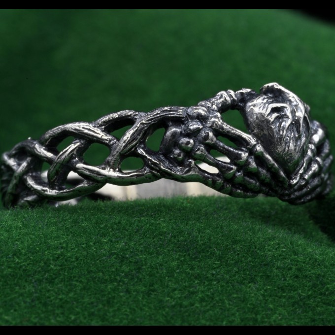 Grasp of the Heart: Gothic Skeleton Hands Ring