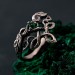 Gothic Silver Ring with Emerald and Celtic Knot Motif